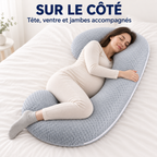 Femme enceinte allongée sur le côté avec le coussin en C